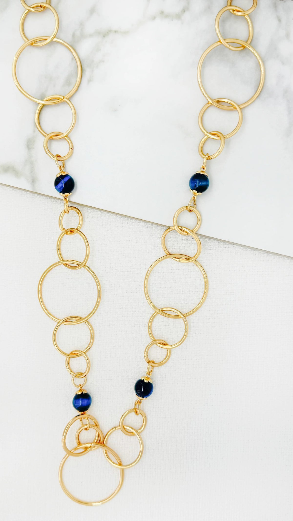 Envy Long gold loop necklace with teal bead design