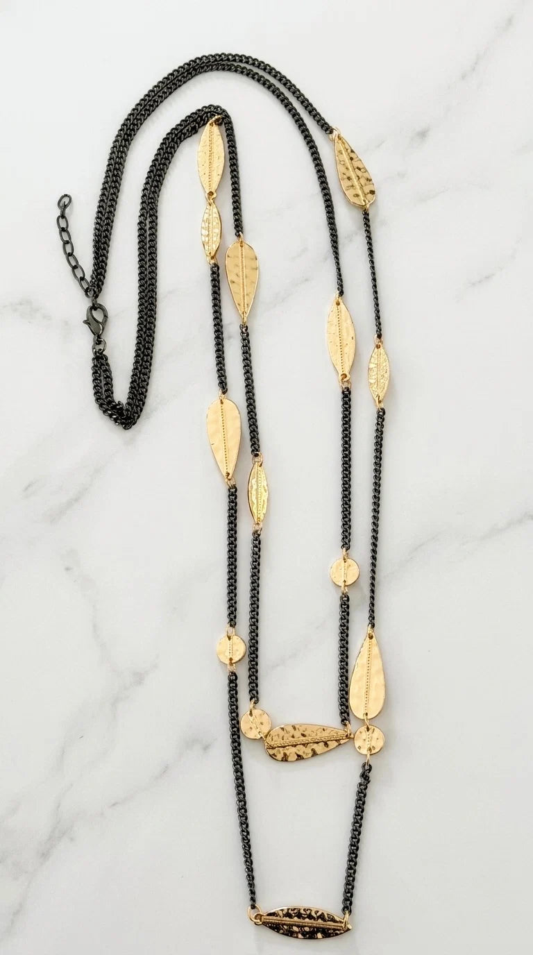 Envy Long black double chain necklace with hammered gold leaf and oval detail