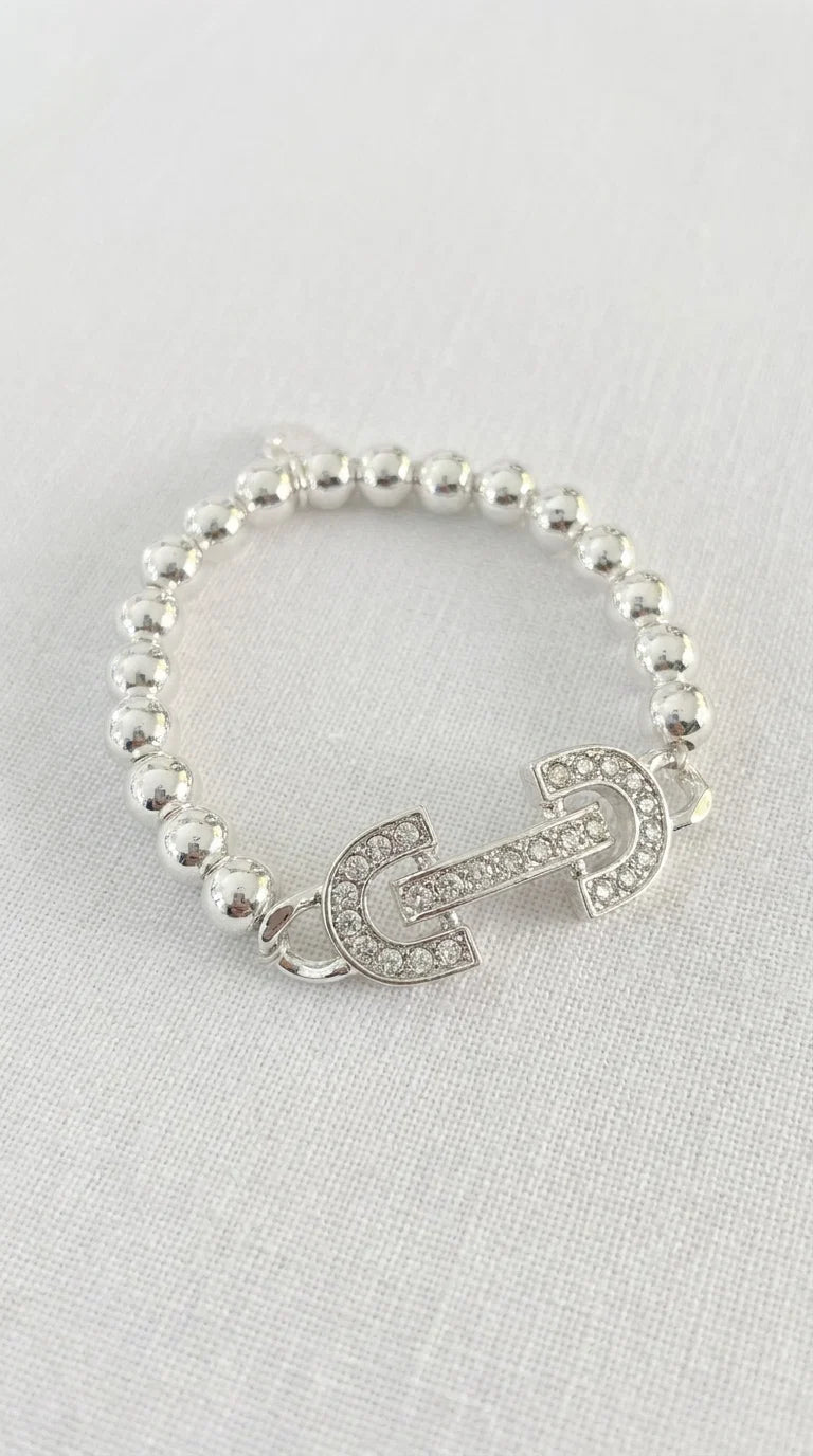 Envy Bracelet Silver beaded elasticted bracelet with diamante horsebit design